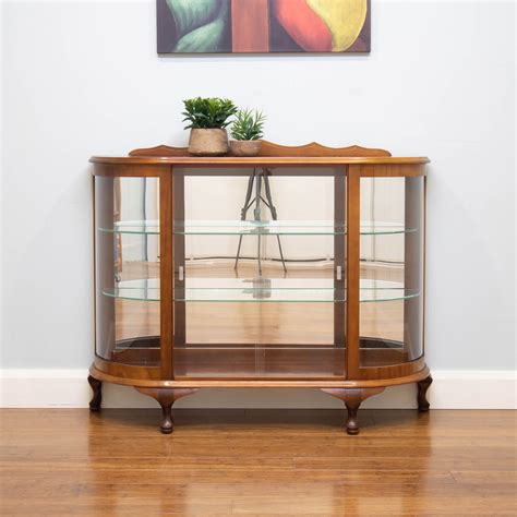 The plateaus are also made of solid beech wood. . Vintage display cabinet with glass doors